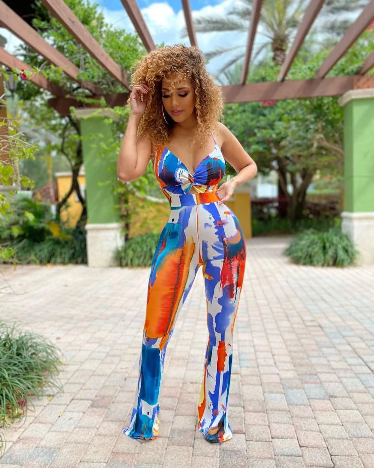 Inez Sleeveless Abstract Print Twist Front Flared Jumpsuit
