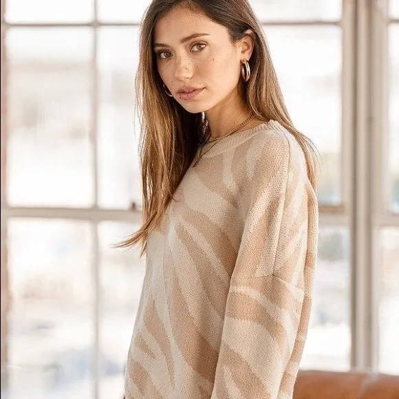 New Lulus Your new favorite Zebra print and cream knit sweater Large