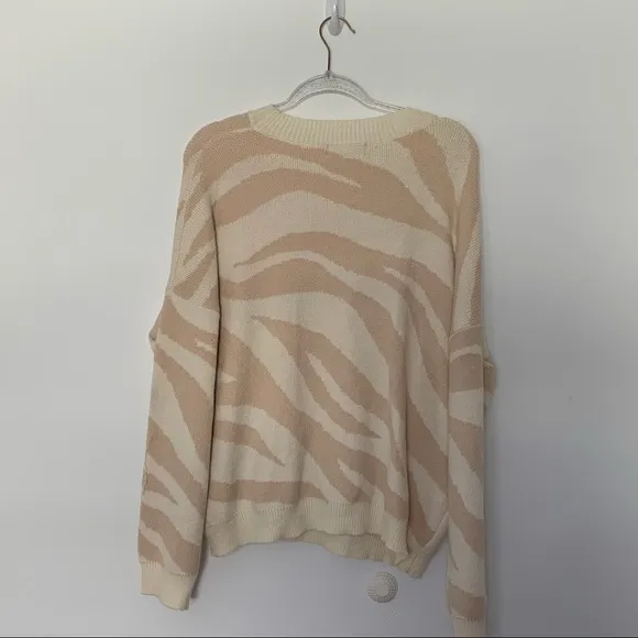 New Lulus Your new favorite Zebra print and cream knit sweater Large