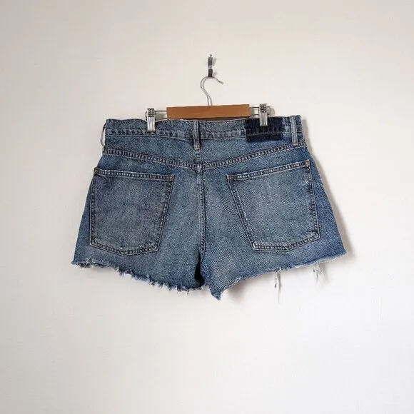 THE GREAT. medium wash blue denim cut off frayed distressed mini jean shorts