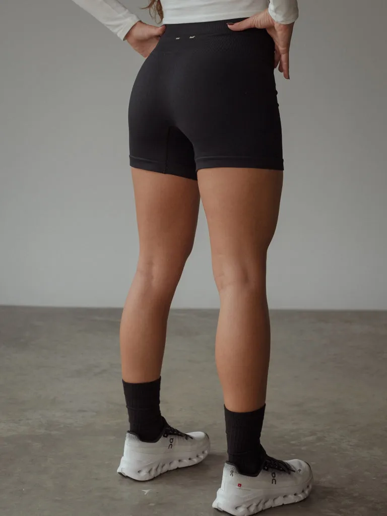 VERSATIL SEAMLESS MINI SHORT  - SHADOW